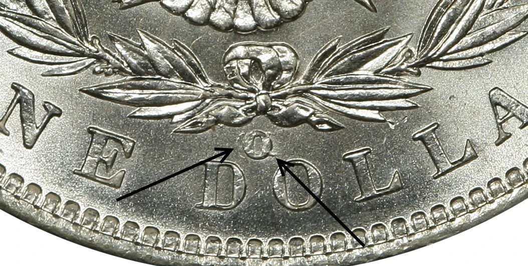 PCGS diagnostic close-up showing remnants of the CC mint mark around an O