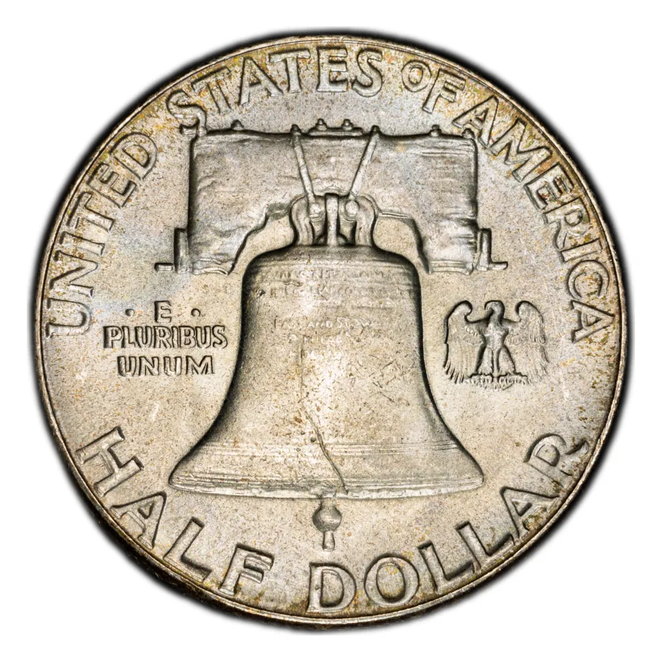 Same 1951 Liberty Bell reverse: the mint-mark area is above the bell; the small eagle is part of the design.